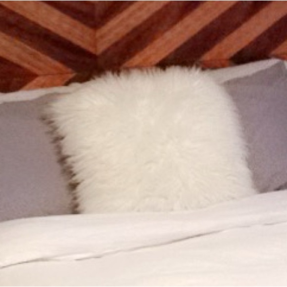 White fuzzy fluffy furry pillow